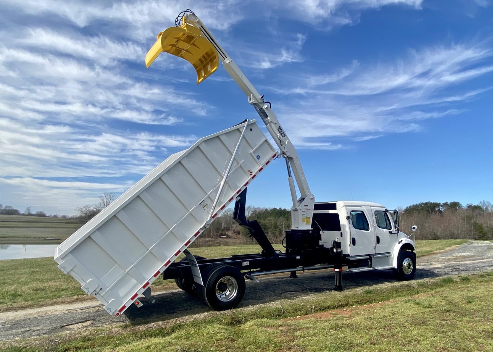 Curbtender Brush Hawg grapple loader